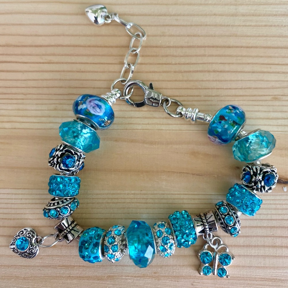 Aqua Blue charm bracelet with heart and butterfly.